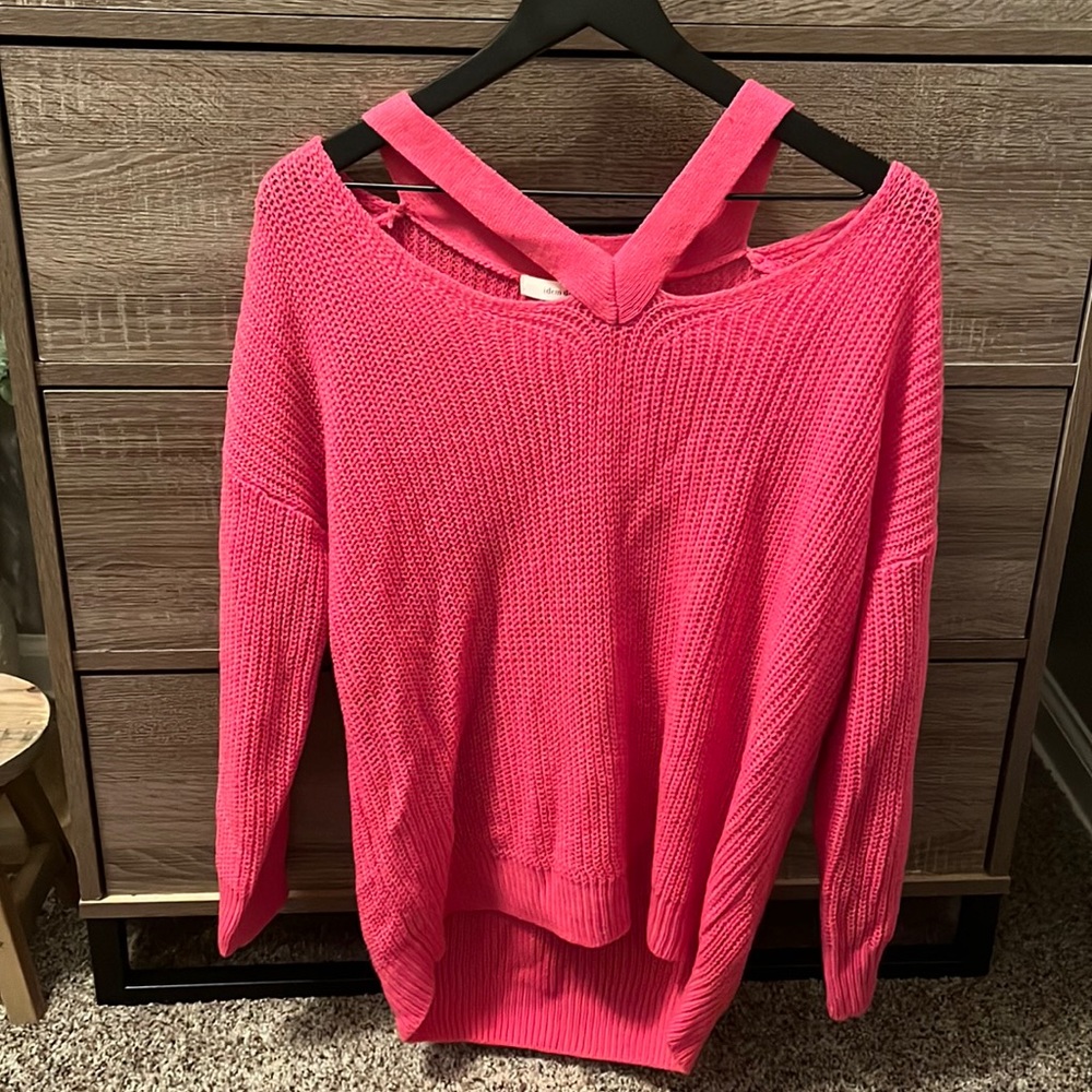 Hot pink sweater with cut out shoulder detail